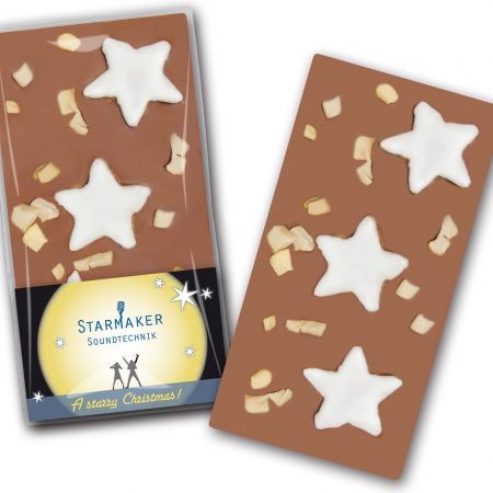 Schokoladentafel mit Zimtsternen und Apfel mit bedruckter Karte